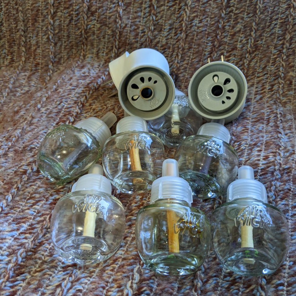7 Empty Air Wick Bottles and 2 Plug Ins
